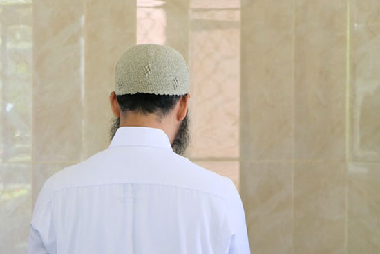 A Muslim man worshiping on Friday, the Muslim day of rest