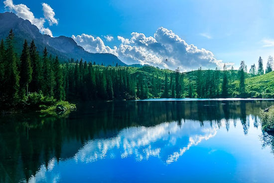 A deep blue lake with mountains, the beautiful things God created before resting on the Sabbath