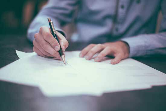  A hand copying manuscripts of the Bible