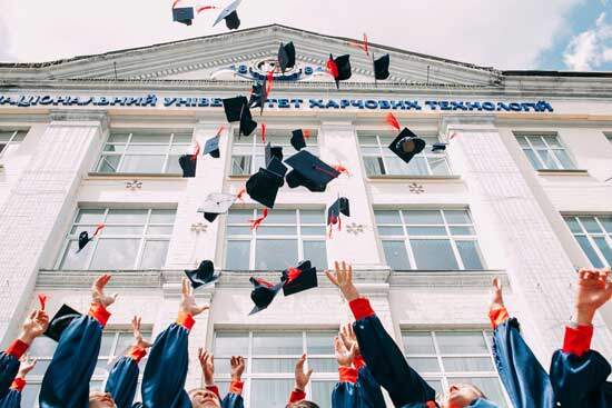 Graduates throwing their graduates caps in joy for their achievement, just as baptism is a joyous occasion symbolizing that we've chosen to follow God