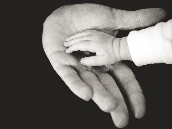 Hand of an infant into the palm of his father, as we study that God called Jeremiah to be a prophet, even before he was born.