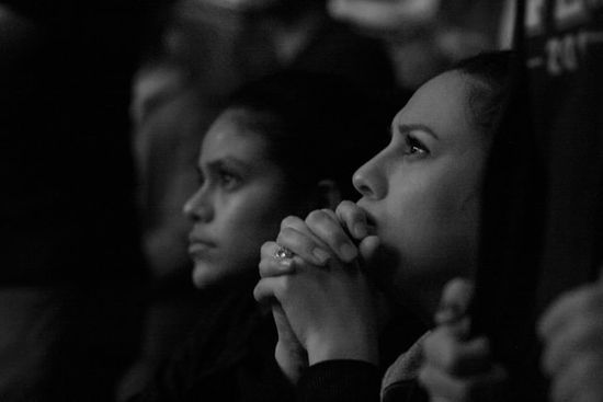 People praying earnestly as early Adventists prayed after the Great Disappointment