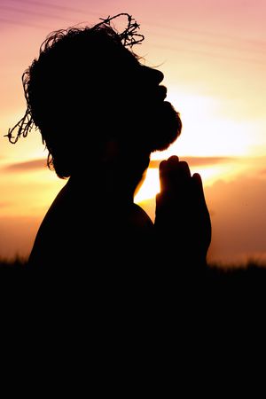 Silhouette of Jesus Christ praying with crown of thorns on His head as we learn more about Ellen White's Desire of Ages.