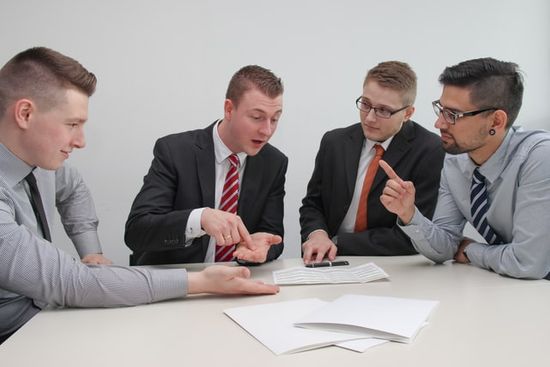 Coworkers having a discussion together at a table