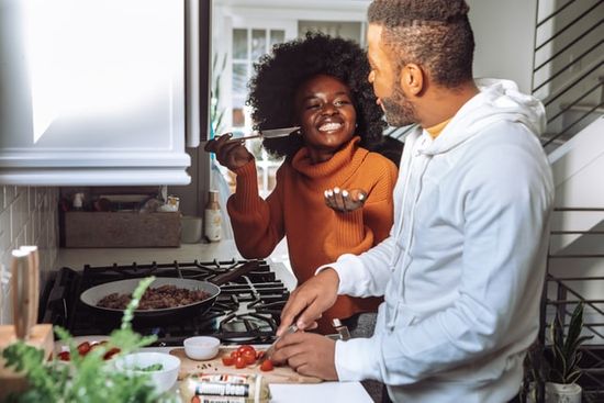 A family preparing their Sabbath meal ahead of time together.