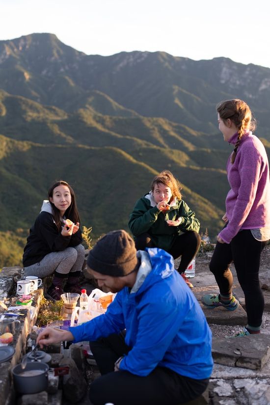 A family celebrates their Sabbath meal tradition eating out in nature.