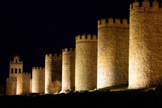 Light shining on city walls at night