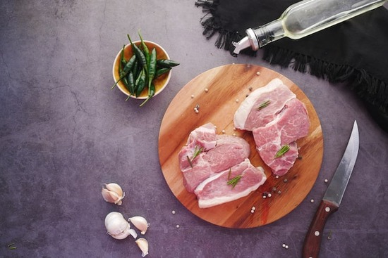 A cutting board with sliced meat