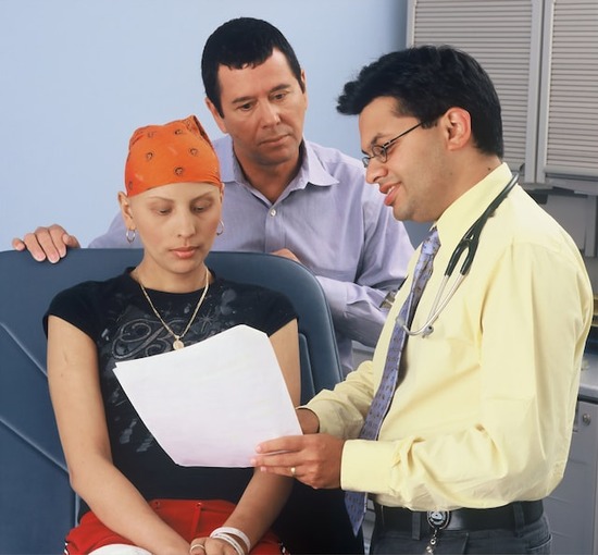 A Seventh-day Adventist doctor ministering to a patient to share the healing ministry of Jesus