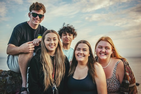 A small group of young adults spending time outdoors together