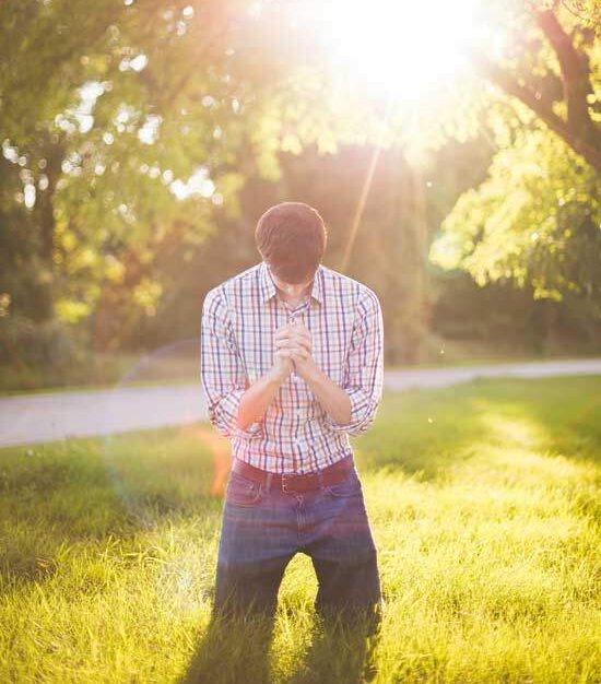 A man praying, accepting the gift of salvation through Jesus, and making the decision for baptism