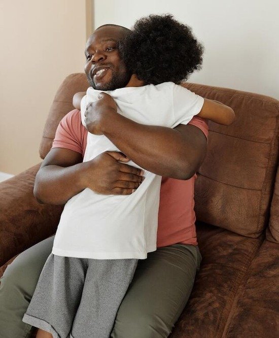 A father hugging his son just as the father of the prodigal son welcomed home his son