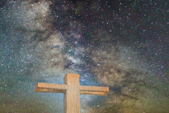 A cross with a starry sky in the background, reminding us of how Jesus revealed the Father's character through His death