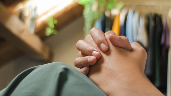 Hands clasped in prayer